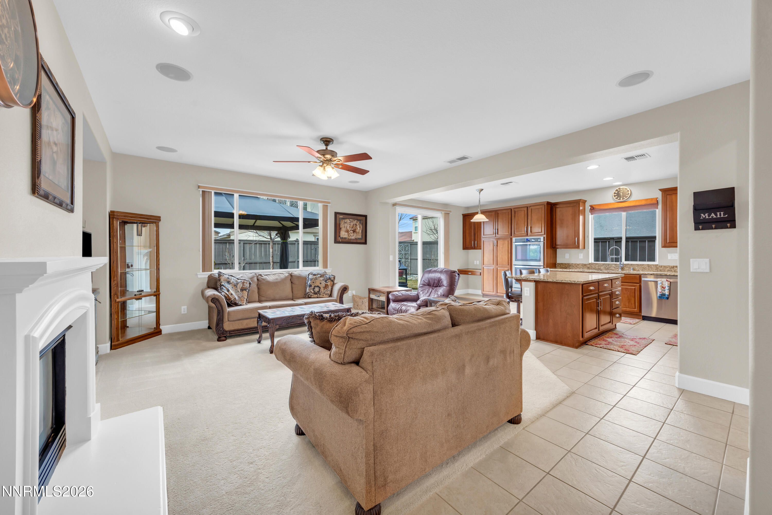 7119 Coldwater Street Sparks, NV 89436 - Photo 21 of 45 a living room with furniture and a fireplace