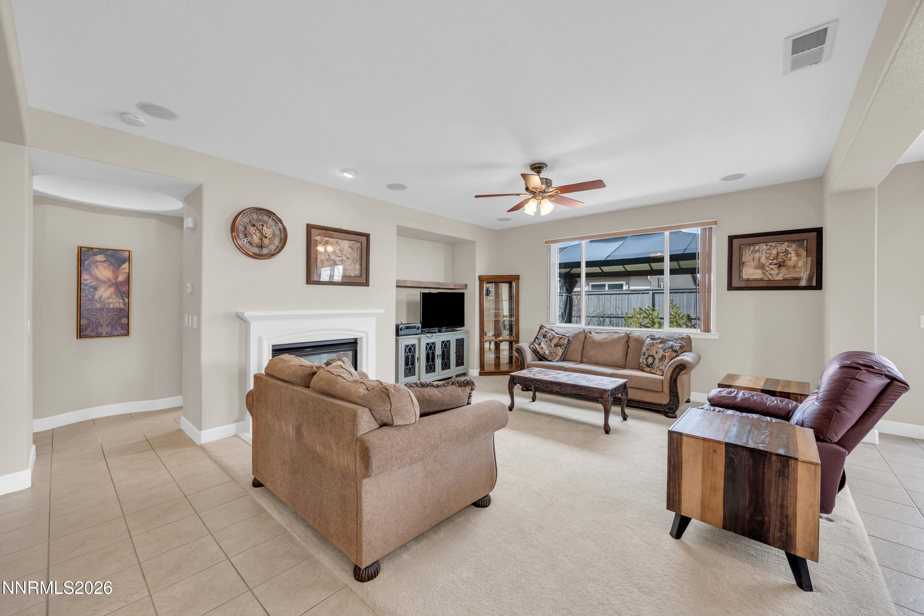 7119 Coldwater Street Sparks, NV 89436 - Photo 22 of 45 a living room with furniture and a fireplace