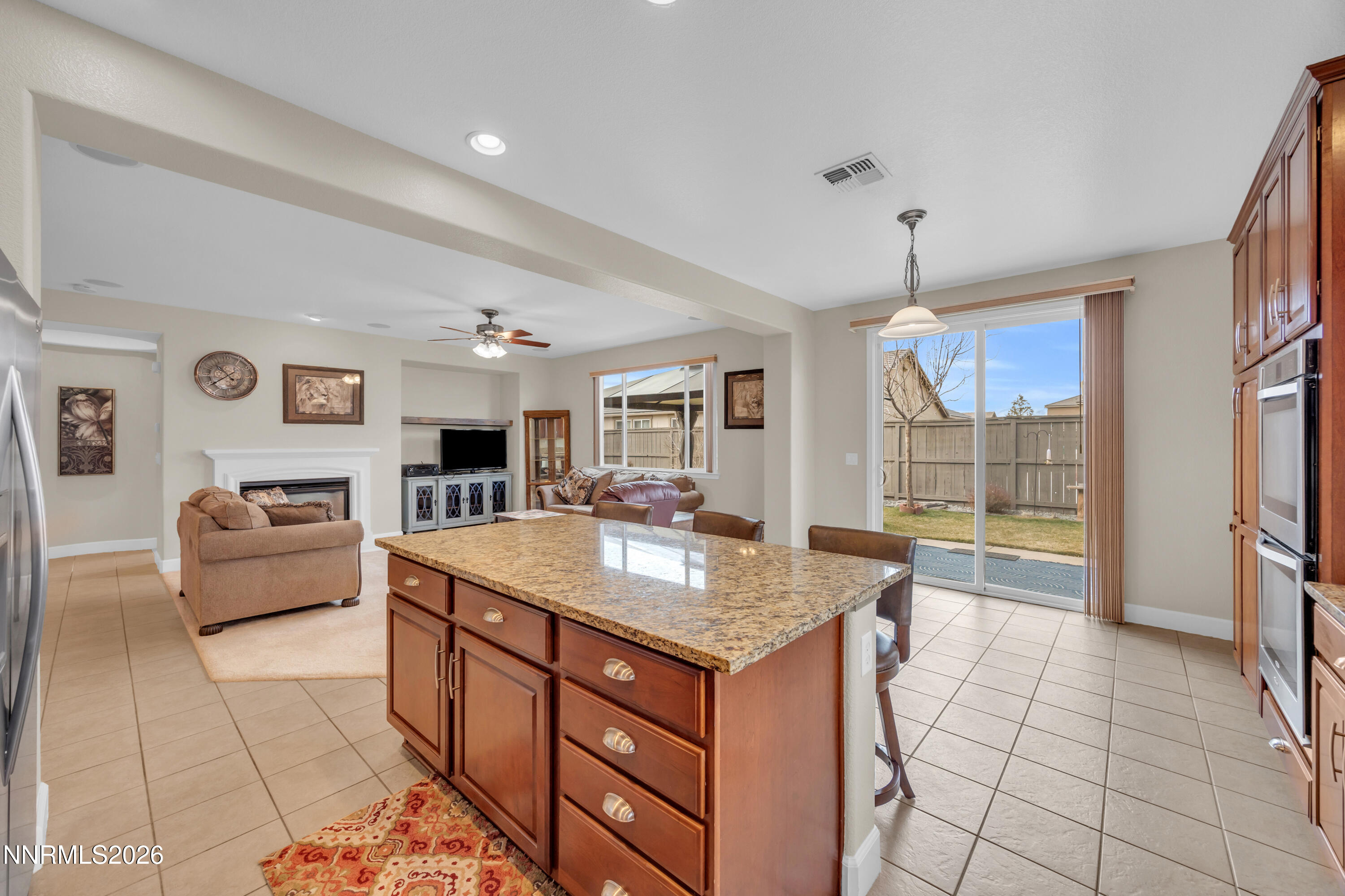 7119 Coldwater Street Sparks, NV 89436 - Photo 27 of 45 a kitchen with granite countertop a sink and a stove