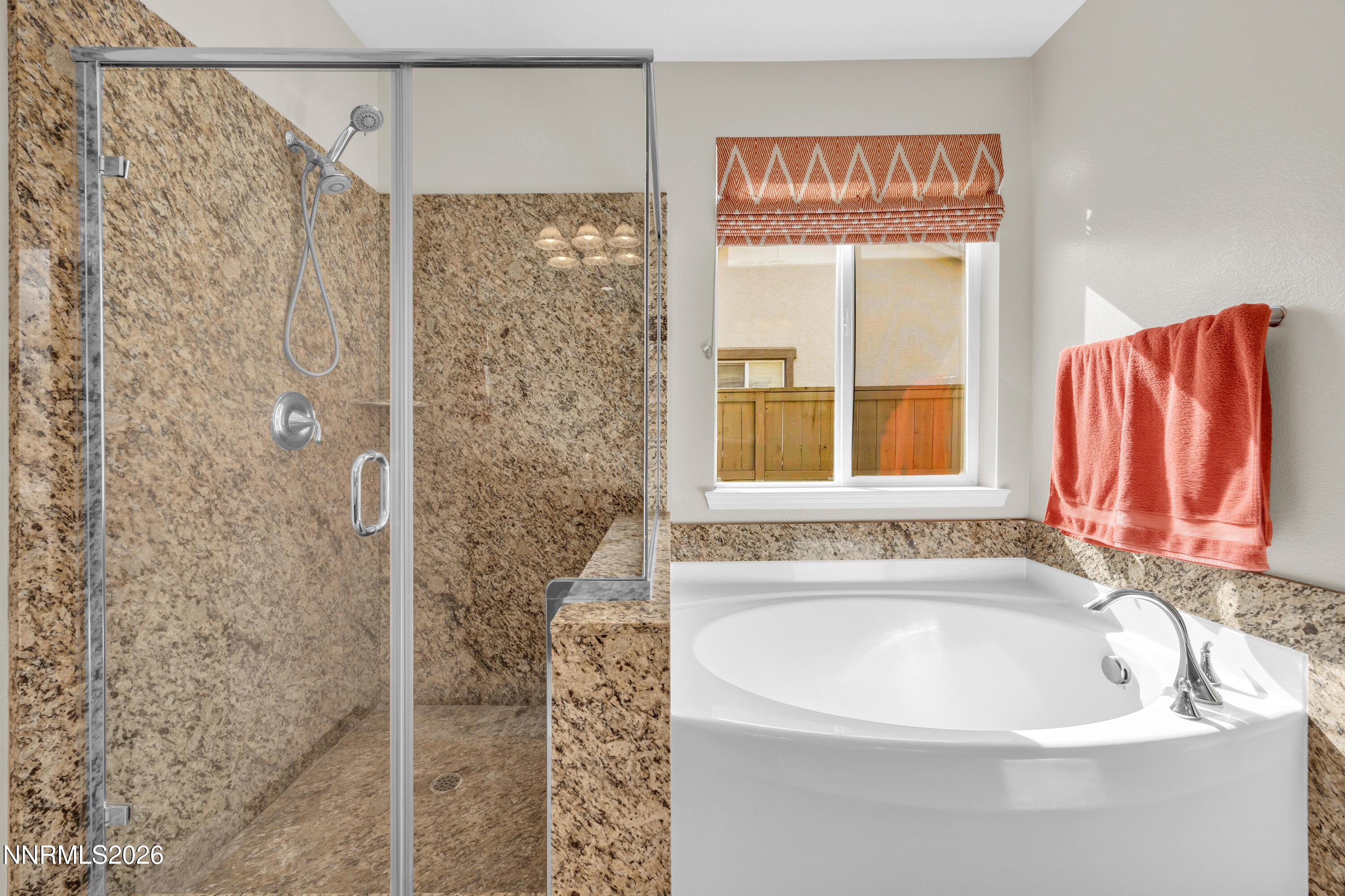 7119 Coldwater Street Sparks, NV 89436 - Photo 34 of 45 a bathroom with a bathtub and shower