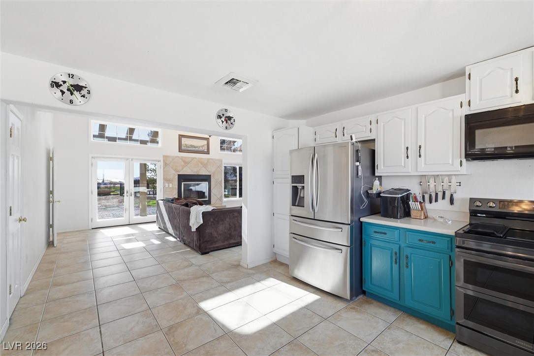 2570 East Kellogg Road Pahrump, NV 89048 - Photo 22 of 60 Large, open kitchen area with beautiful views. Newer stainless steel dishwasher and stove.