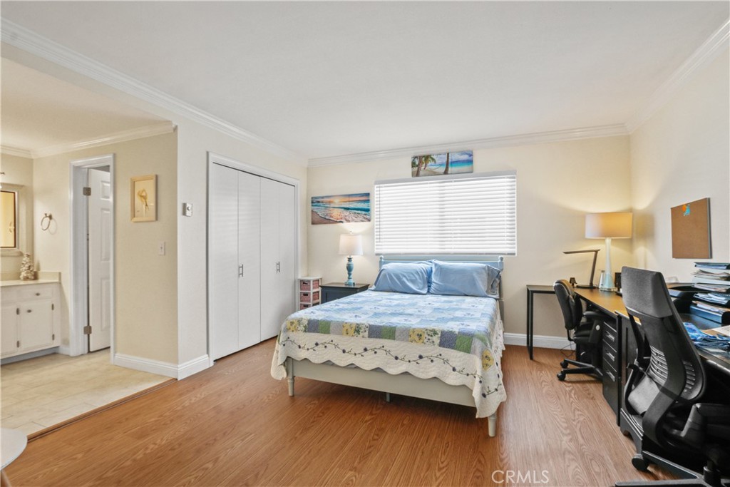 215 Valley Drive Hermosa Beach, CA 90254 - Photo 12 of 27 a bedroom with a bed and wooden floor