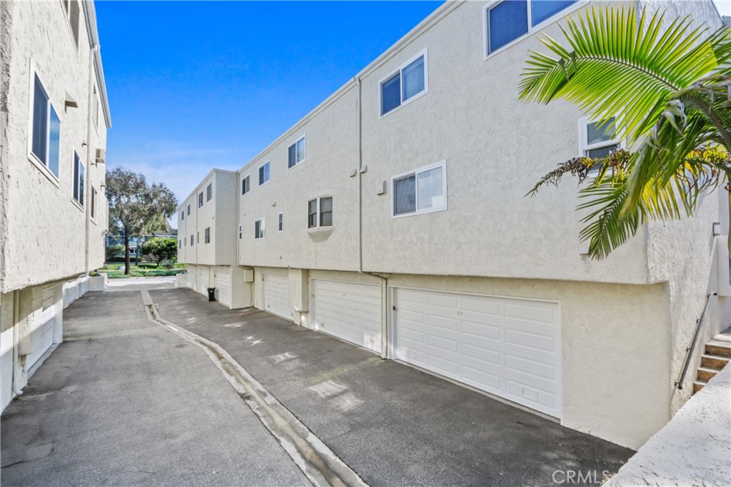 215 Valley Drive Hermosa Beach, CA 90254 - Photo 19 of 27 a view of a house with a palm tree