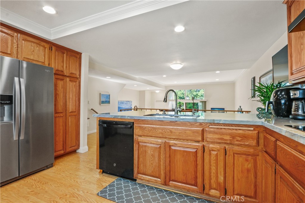 215 Valley Drive Hermosa Beach, CA 90254 - Photo 5 of 27 a kitchen with stainless steel appliances granite countertop a refrigerator and a sink