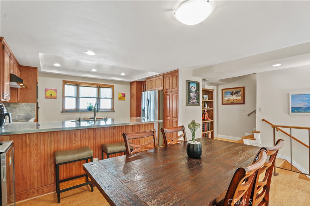 215 Valley Drive Hermosa Beach, CA 90254 - Photo 6 of 27 a dining room with wooden floor and large window