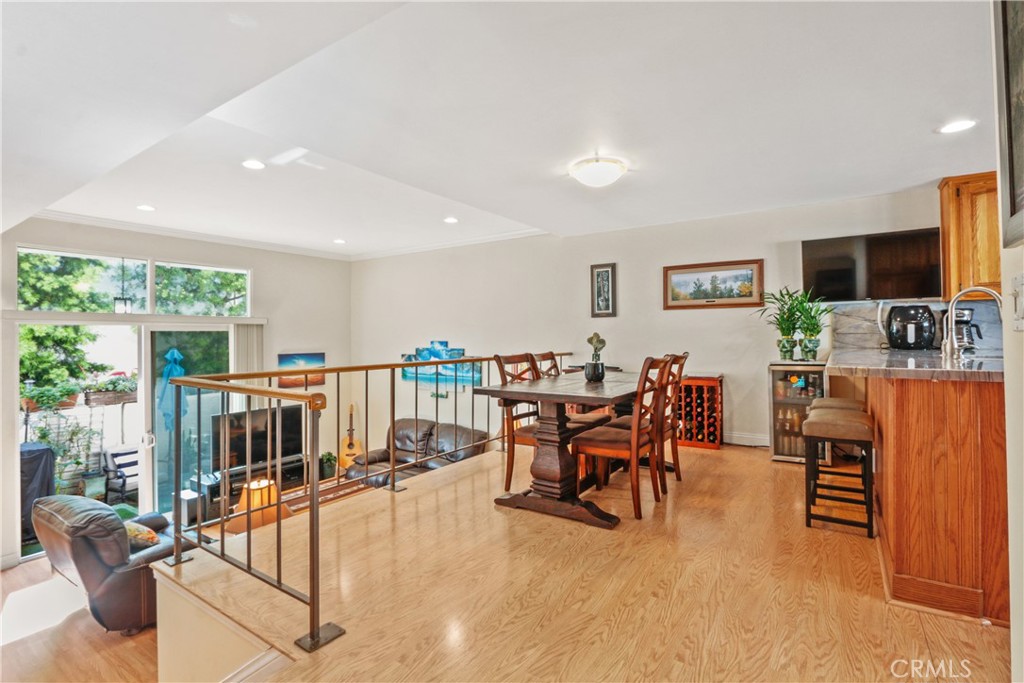 215 Valley Drive Hermosa Beach, CA 90254 - Photo 7 of 27 a living room with furniture a flat screen tv and floor to ceiling window