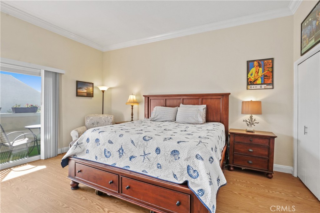 215 Valley Drive Hermosa Beach, CA 90254 - Photo 9 of 27 a bedroom with a bed and painting on the wall