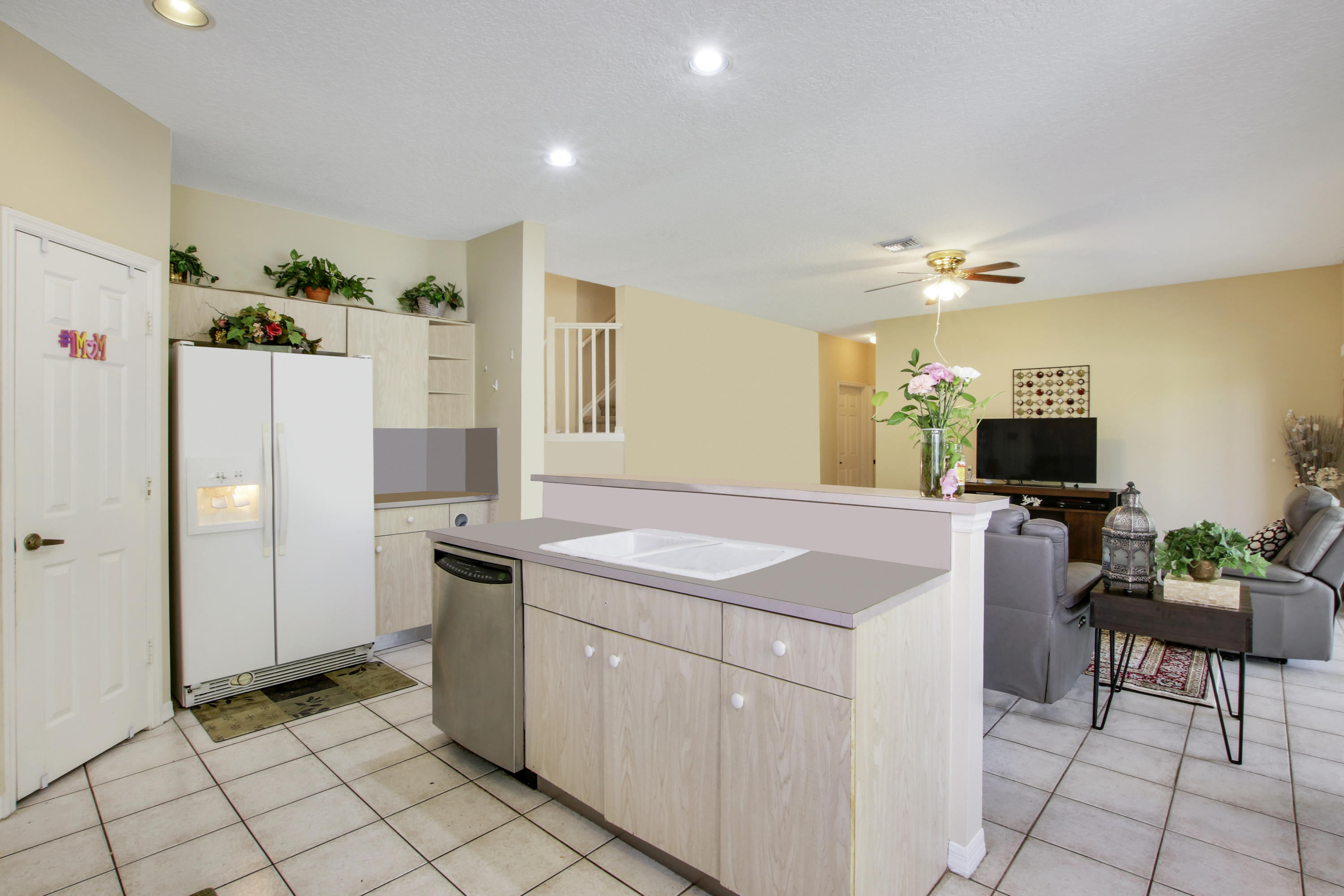 22048 Altona Drive Boca Raton, FL 33428 - Photo 12 of 33 a kitchen with a sink and a refrigerator
