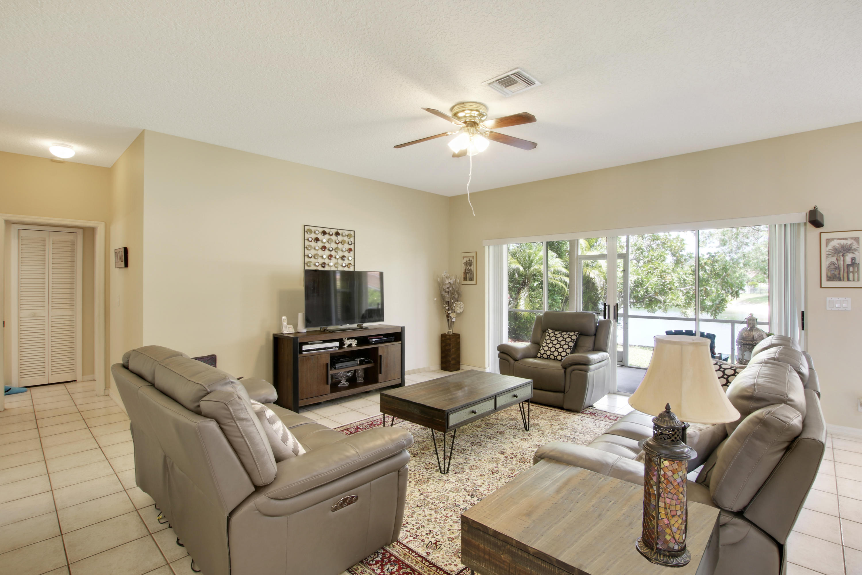 22048 Altona Drive Boca Raton, FL 33428 - Photo 14 of 33 a living room with furniture and a flat screen tv
