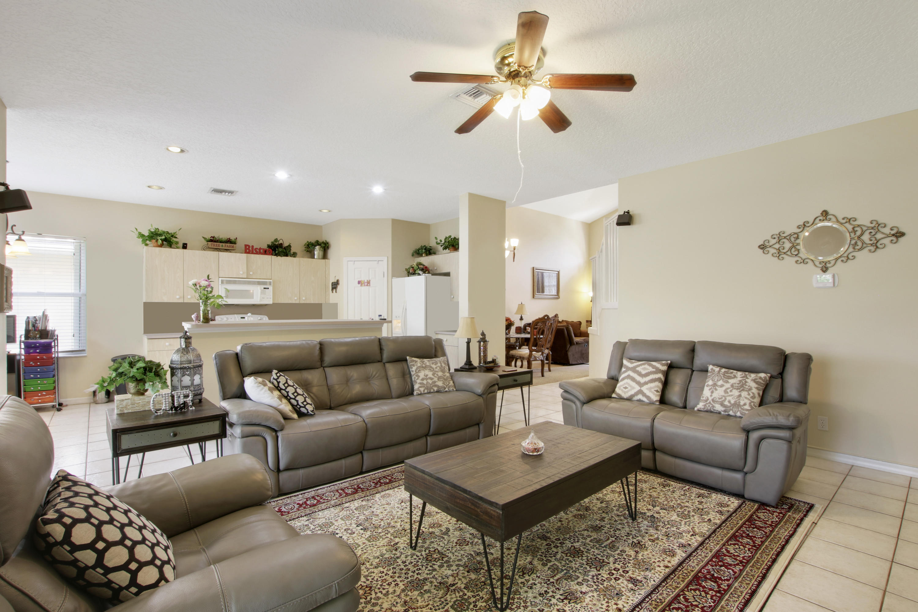 22048 Altona Drive Boca Raton, FL 33428 - Photo 16 of 33 a living room with furniture and a chandelier