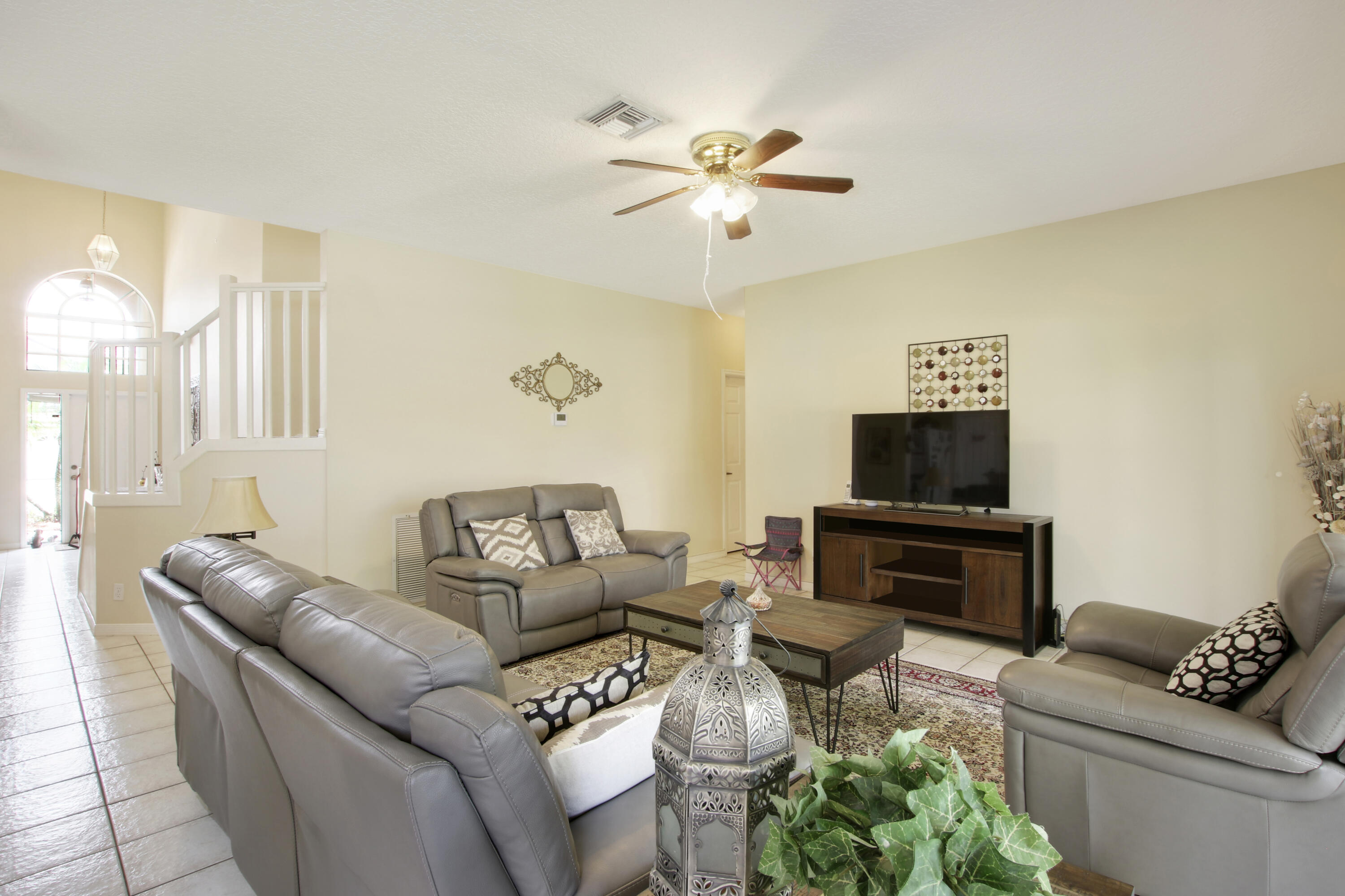22048 Altona Drive Boca Raton, FL 33428 - Photo 17 of 33 a living room with furniture and a flat screen tv