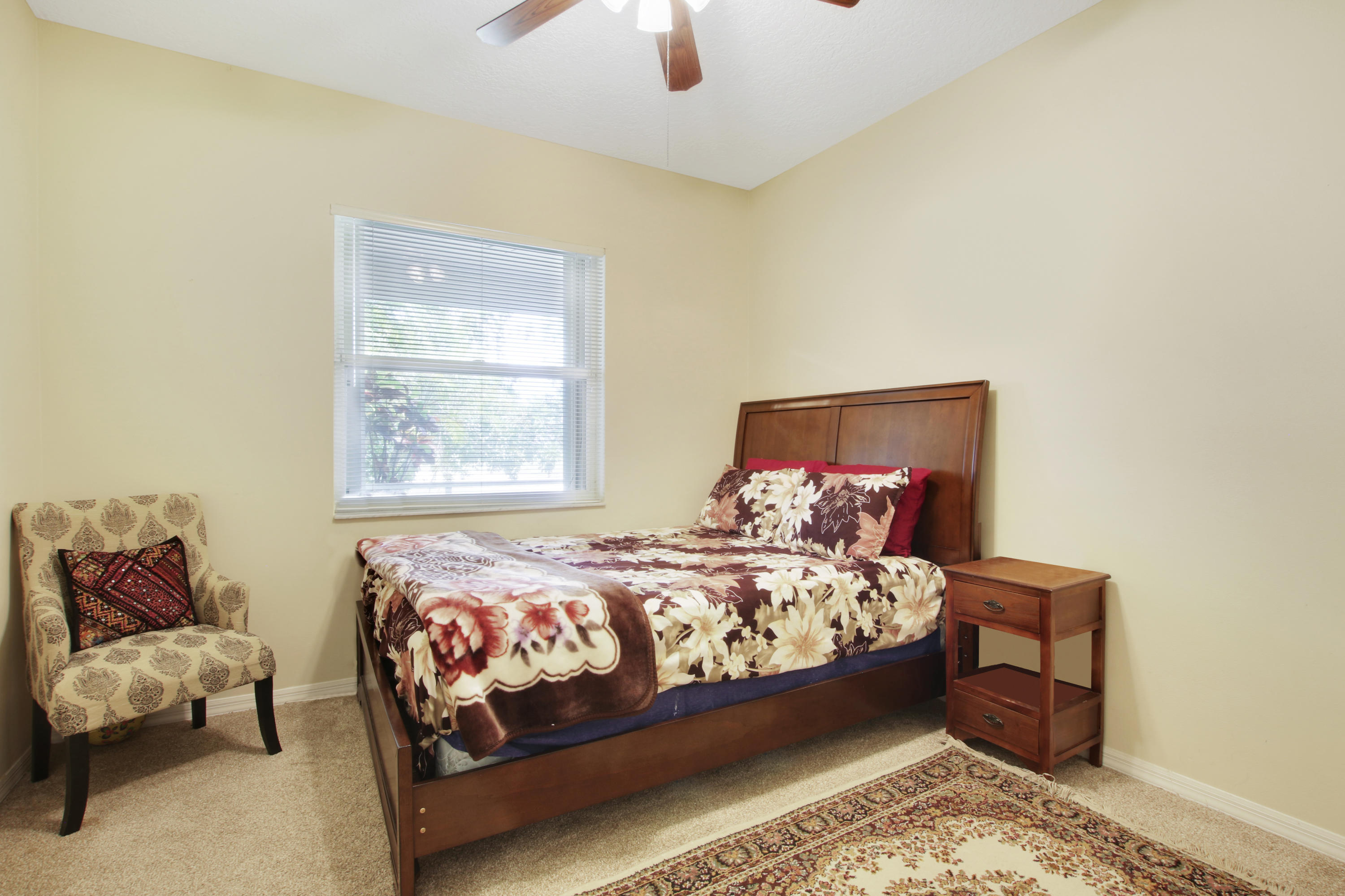 22048 Altona Drive Boca Raton, FL 33428 - Photo 18 of 33 a bedroom with a bed and window