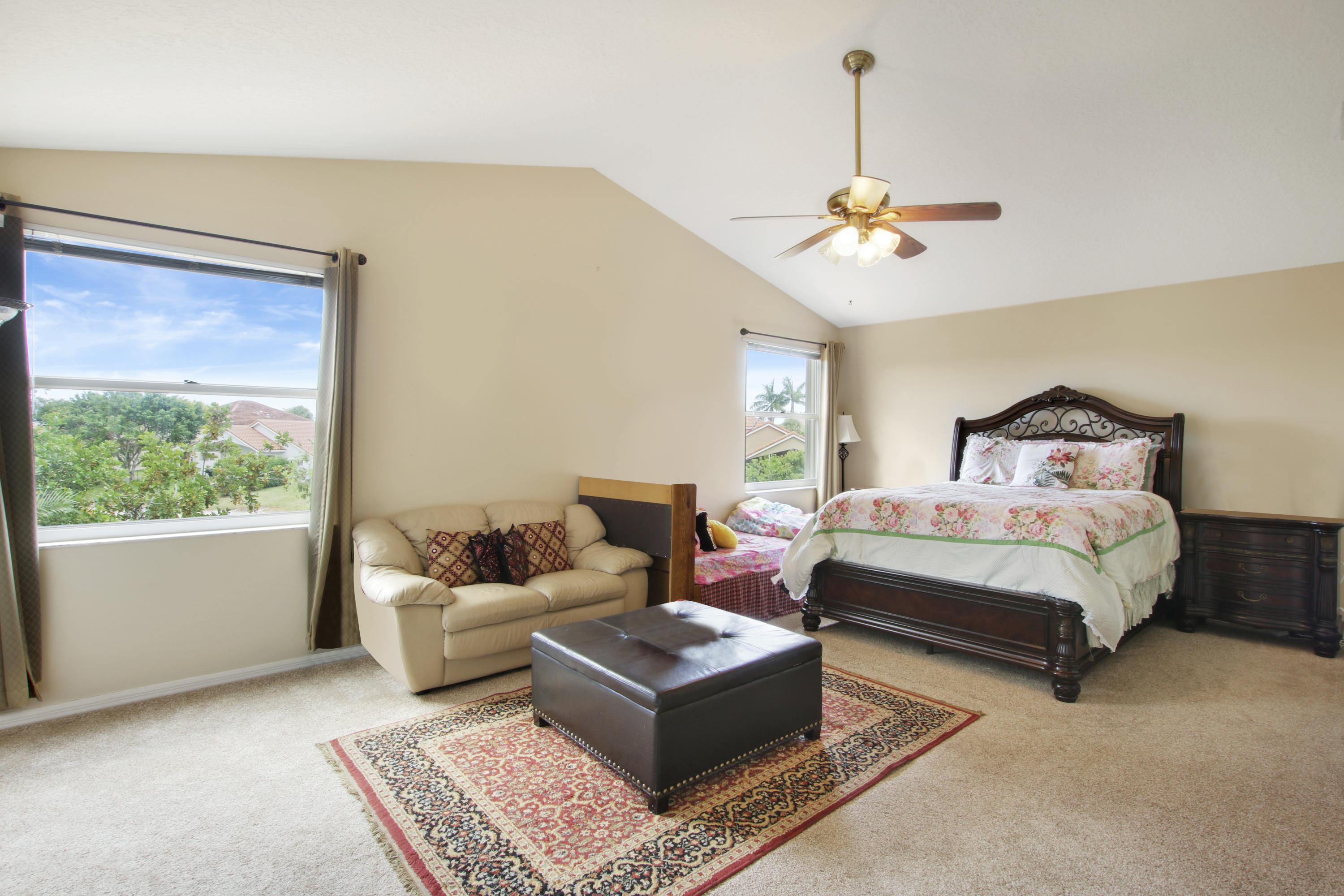 22048 Altona Drive Boca Raton, FL 33428 - Photo 20 of 33 a bedroom with a bed couch and window