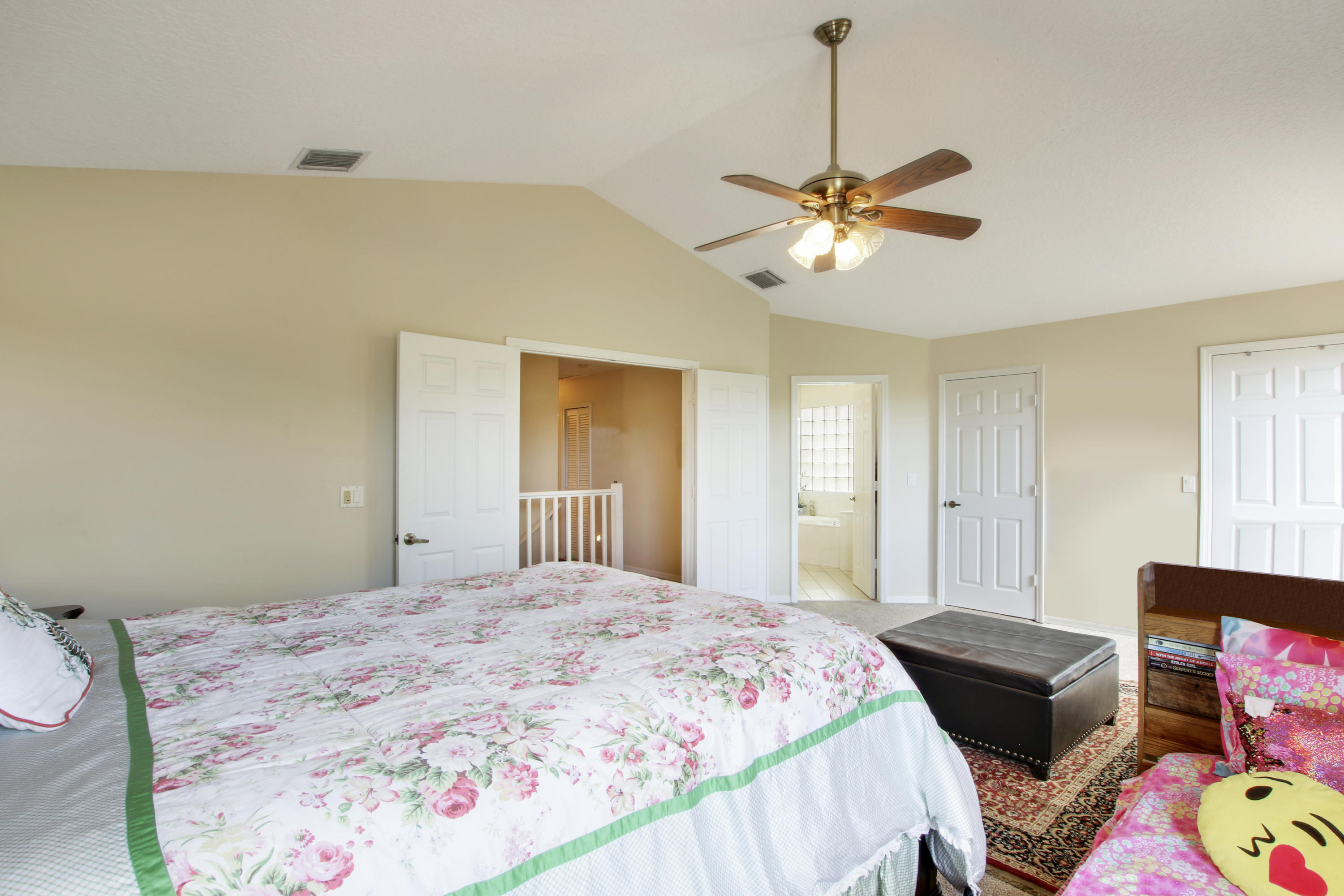 22048 Altona Drive Boca Raton, FL 33428 - Photo 21 of 33 a bedroom with a bed chandelier and a window