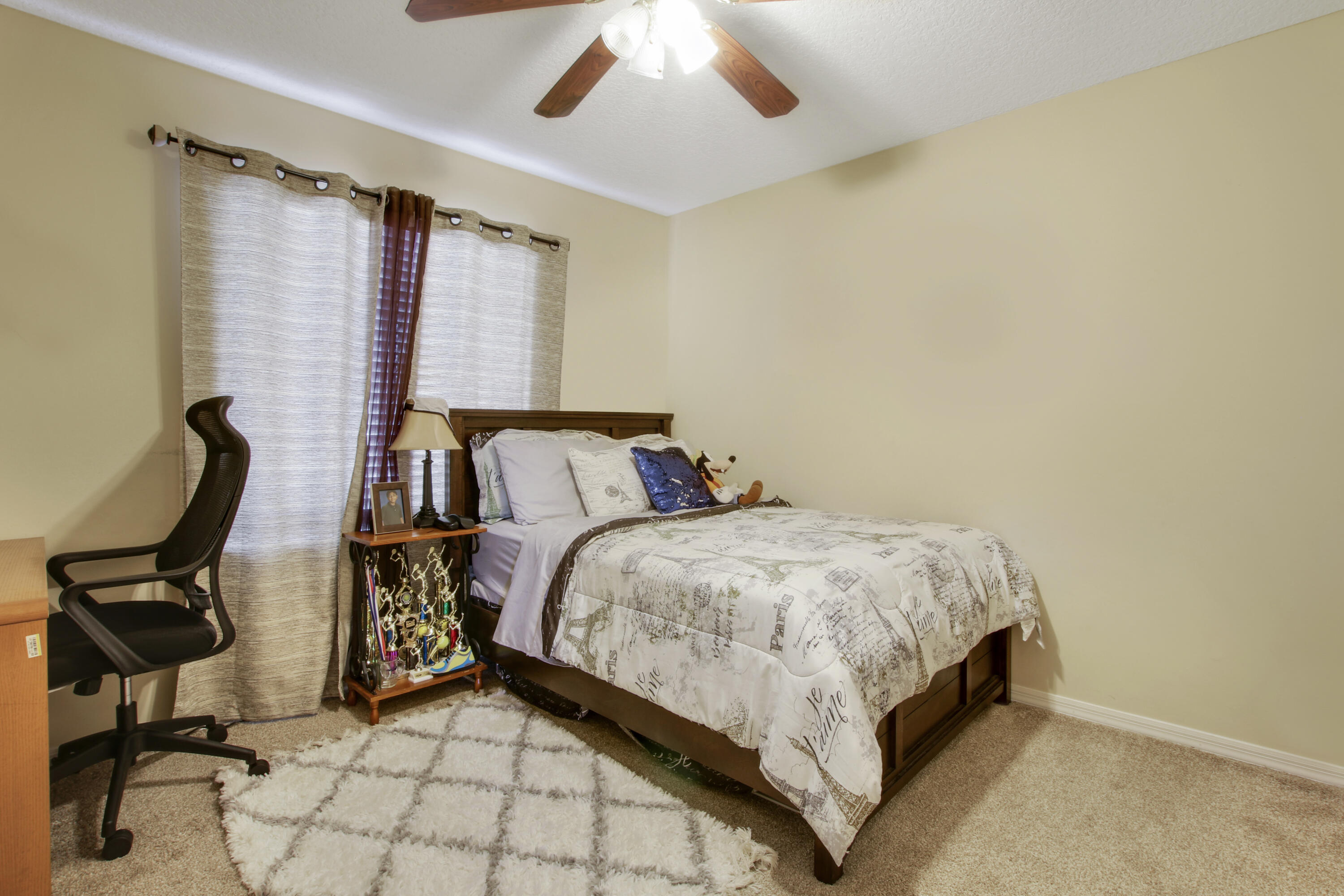 22048 Altona Drive Boca Raton, FL 33428 - Photo 24 of 33 a bedroom with a bed a chair and dresser