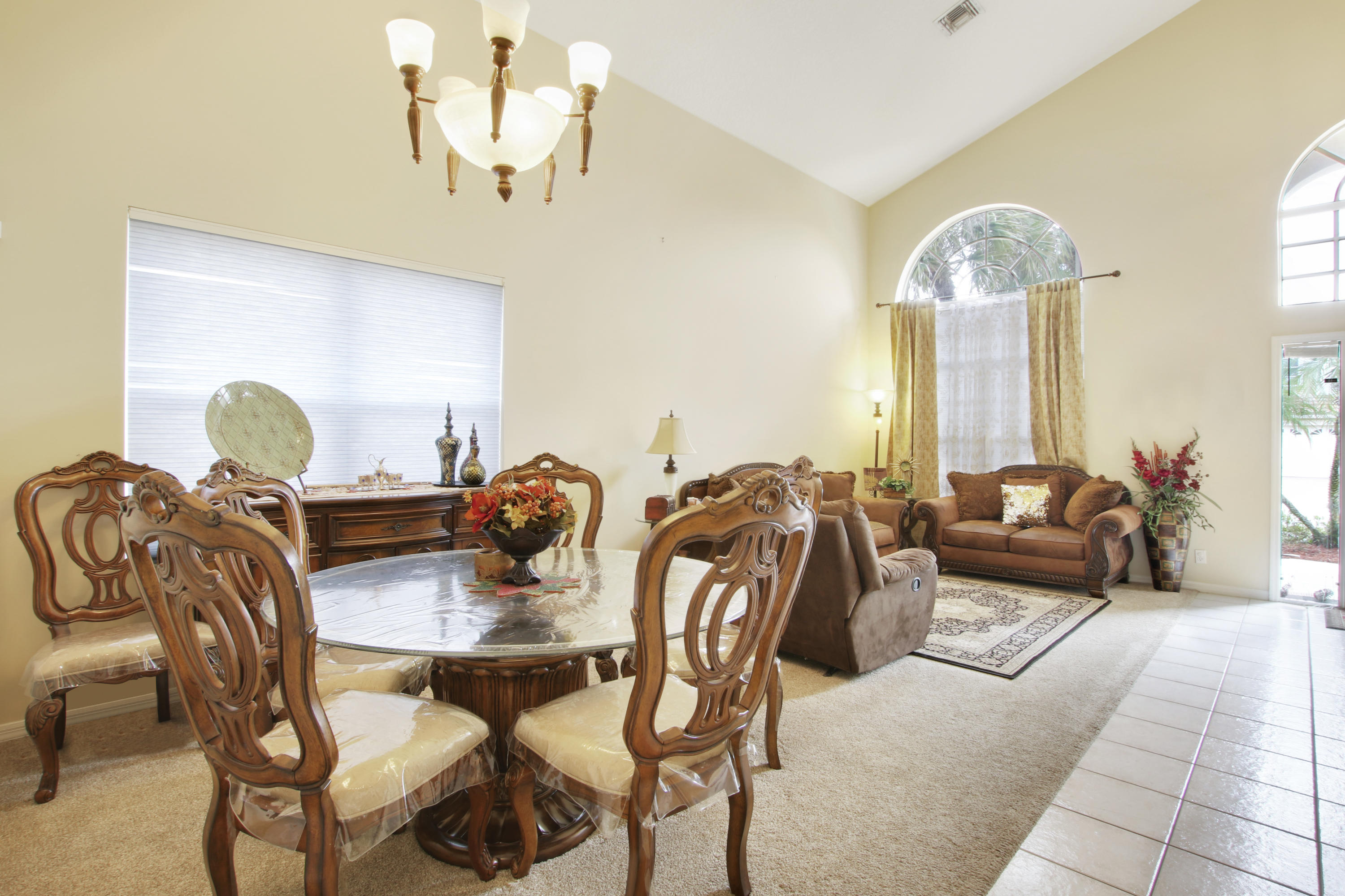 22048 Altona Drive Boca Raton, FL 33428 - Photo 6 of 33 a view of a dining room with furniture and chandelier