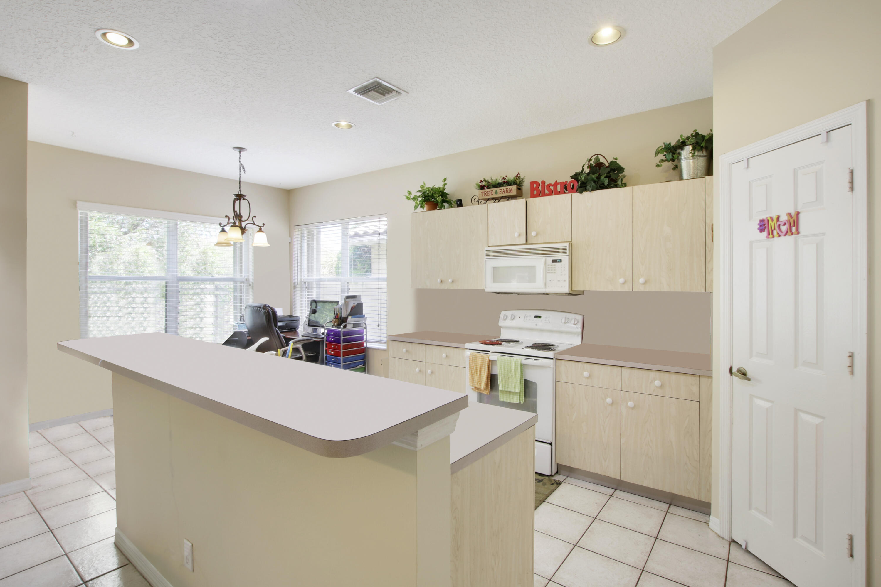 22048 Altona Drive Boca Raton, FL 33428 - Photo 9 of 33 a room with a white cabinets and white appliances