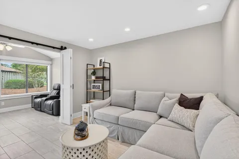 a living room with furniture and a large window