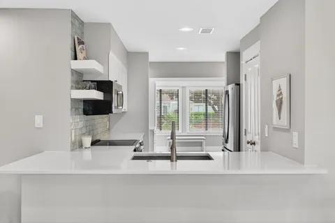 a bathroom with a tub and a mirror