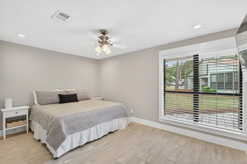 a bedroom with a large bed and a window