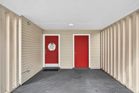 a view of an entryway with a hallway