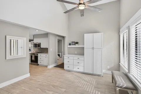 a room with a dresser and a window