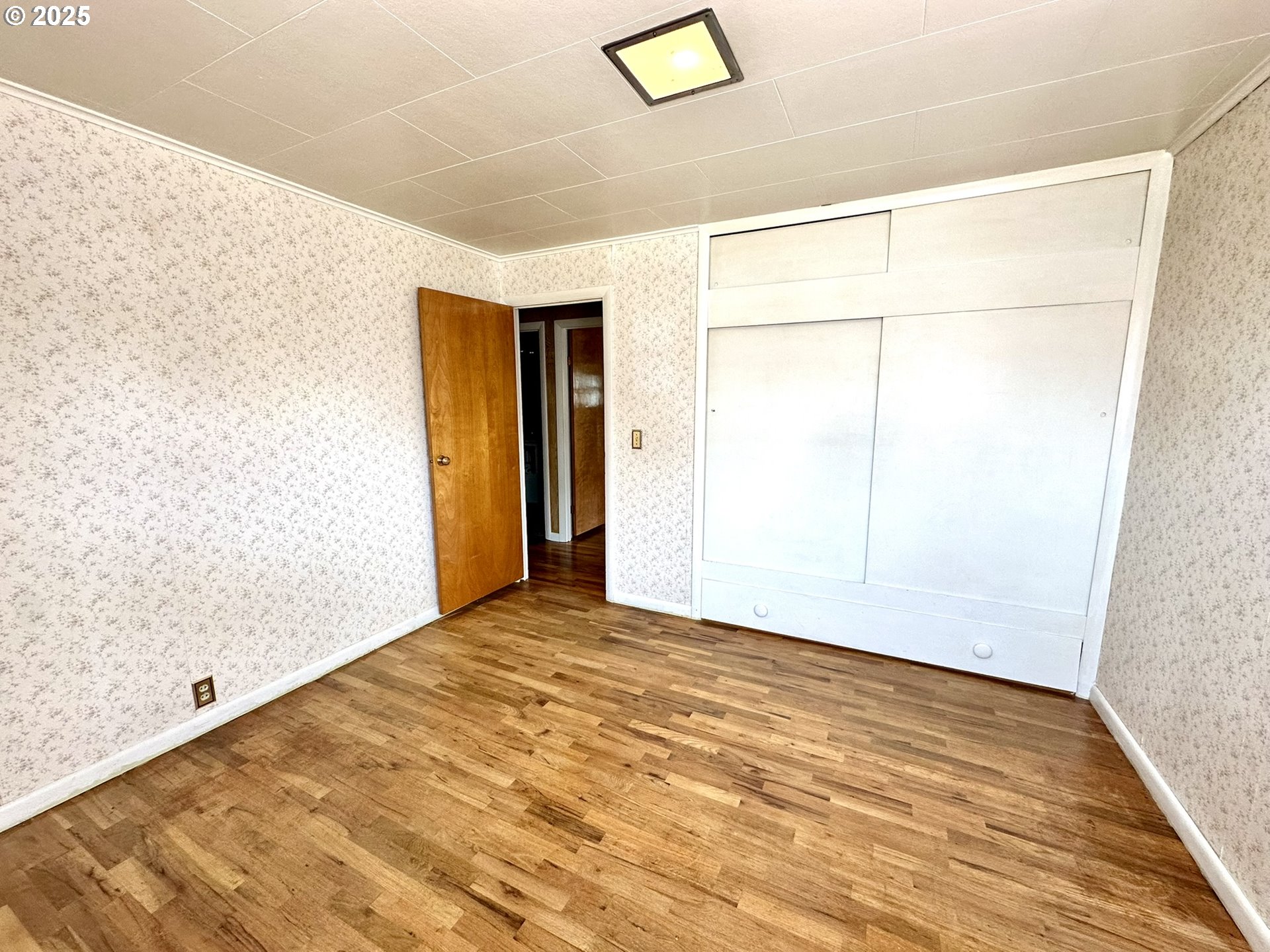 2460 Clark Street Baker City, OR 97814 - Photo 13 of 46 a view of an empty room with wooden floor
