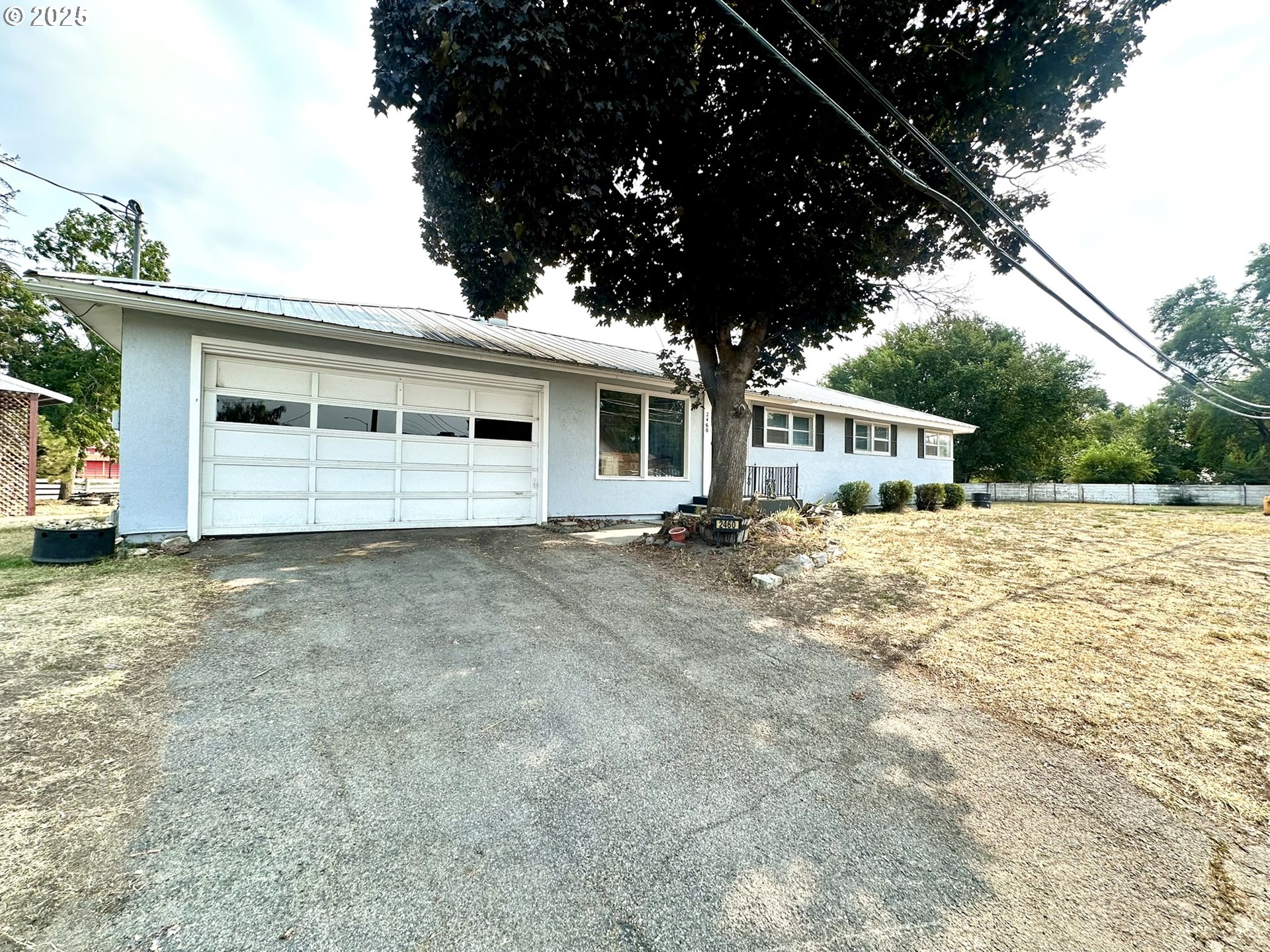 2460 Clark Street Baker City, OR 97814 - Photo 2 of 46 a view of house with yard and sitting area