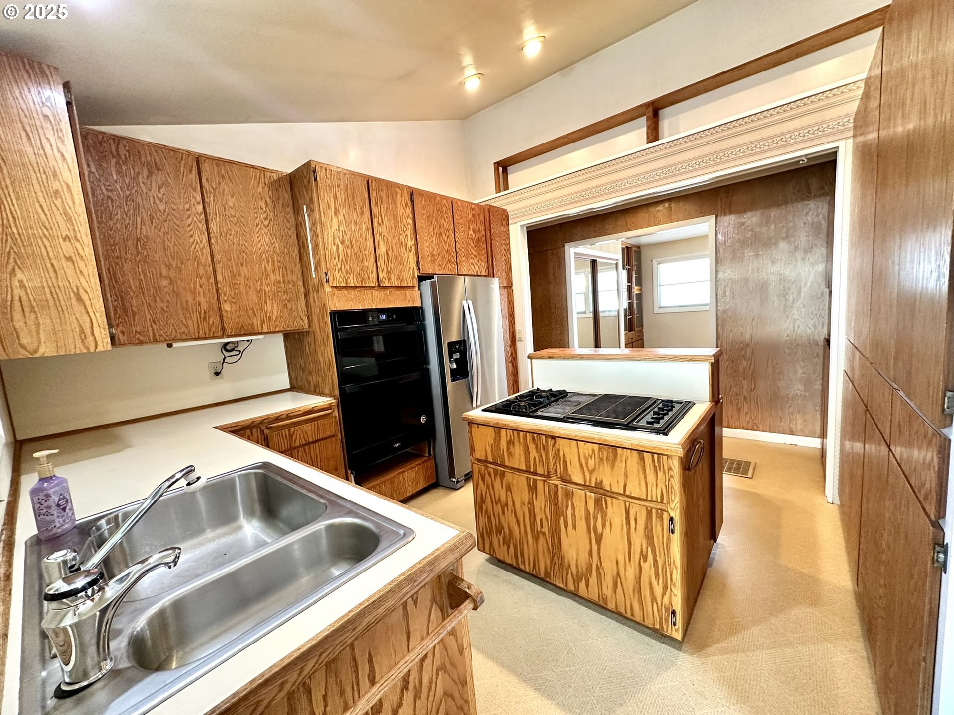 2460 Clark Street Baker City, OR 97814 - Photo 26 of 46 a kitchen with stainless steel appliances granite countertop a sink stove and refrigerator