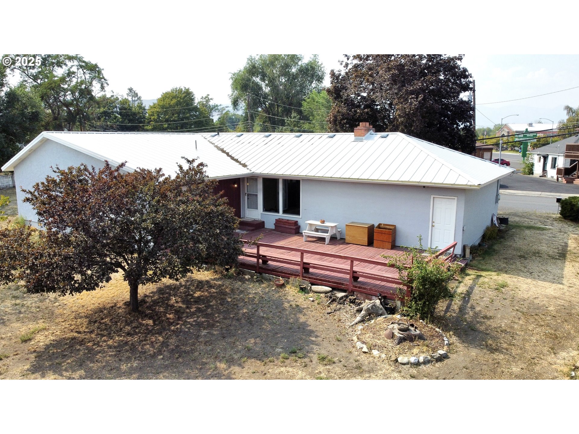 2460 Clark Street Baker City, OR 97814 - Photo 3 of 46 a backyard of a house with yard table and chairs