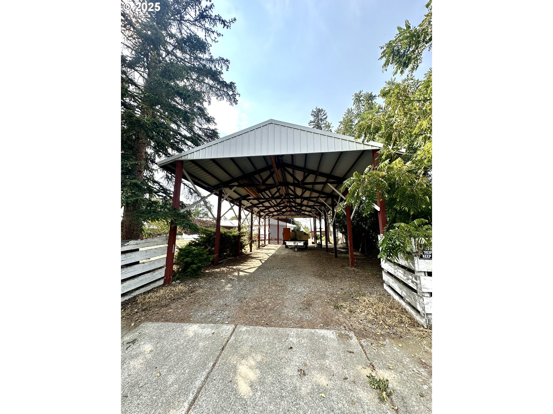 2460 Clark Street Baker City, OR 97814 - Photo 45 of 46 a view of a patio with table and chairs under an umbrella