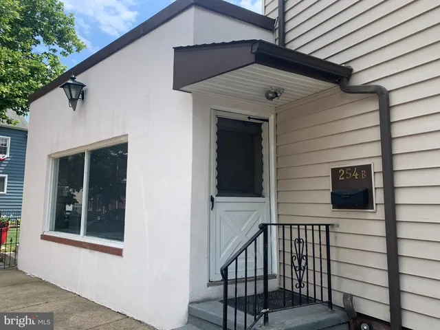 a view of a house with a door and wooden floor