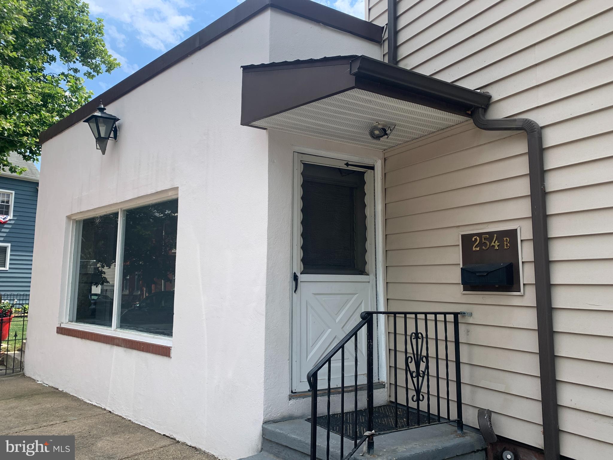 a view of a house with a door and wooden floor