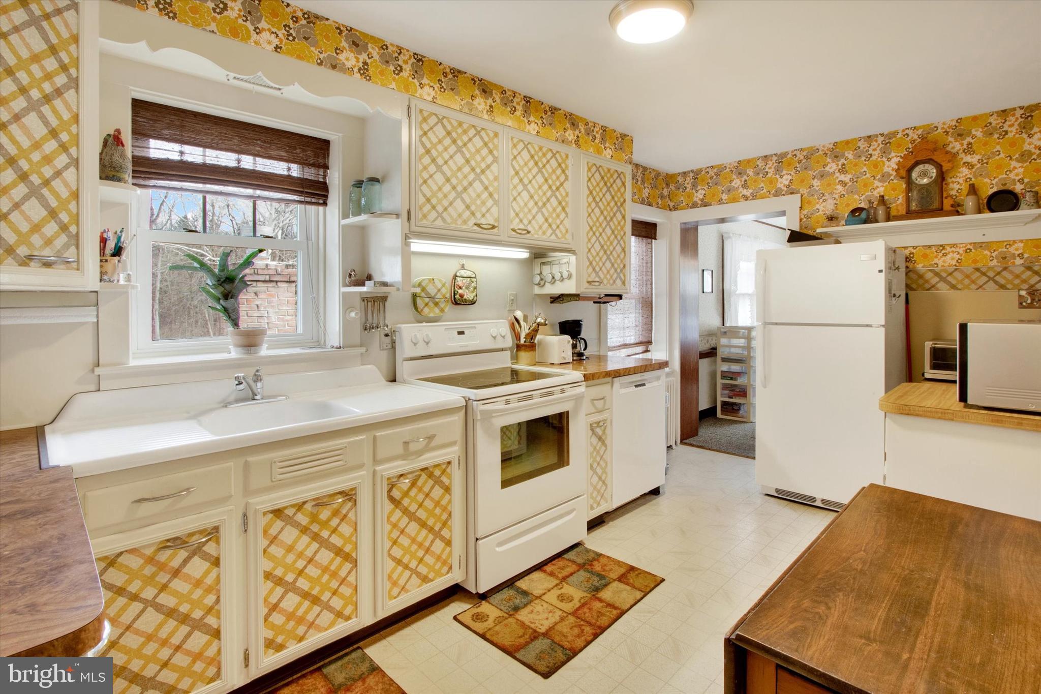 317 Oley Furnace Road Fleetwood, PA 19522 - Photo 12 of 43 a kitchen with stainless steel appliances a stove a sink and a refrigerator