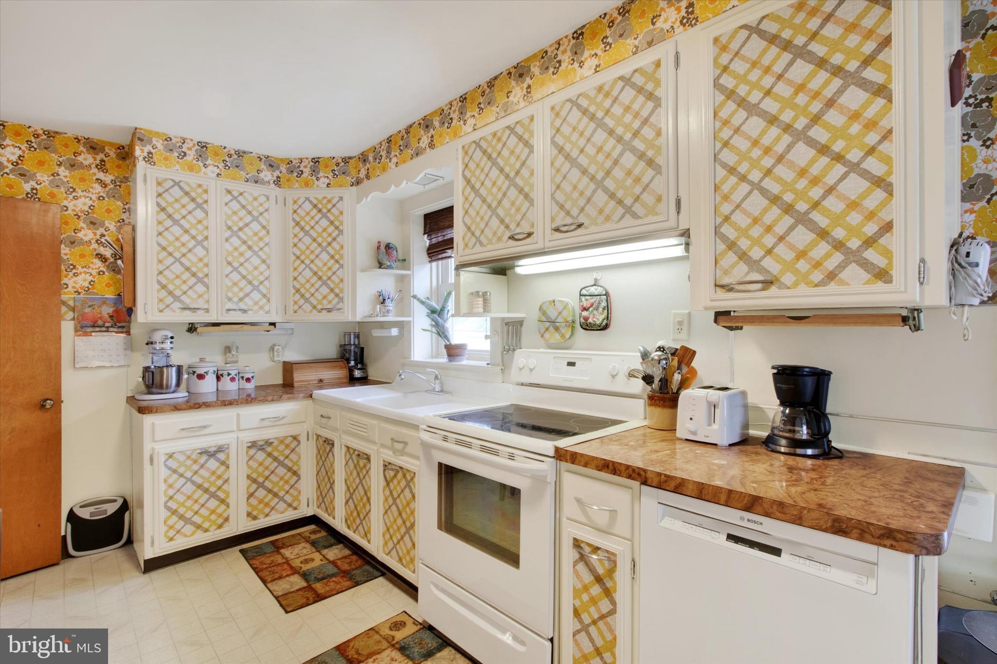 317 Oley Furnace Road Fleetwood, PA 19522 - Photo 13 of 43 a kitchen with stainless steel appliances a sink a stove and a window