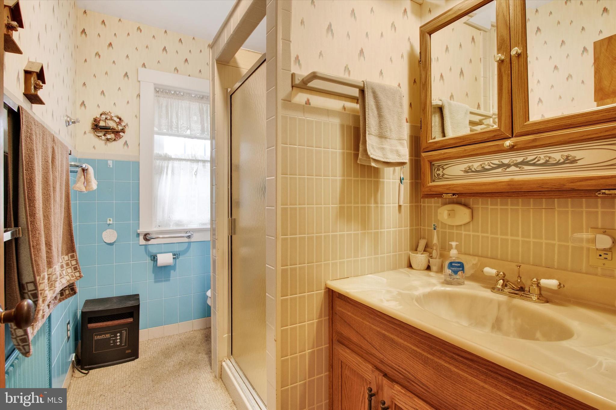317 Oley Furnace Road Fleetwood, PA 19522 - Photo 21 of 43 a bathroom with a granite countertop sink a mirror and a shower