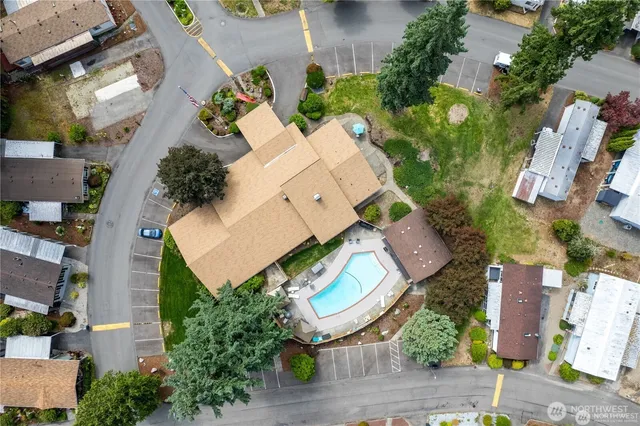 an aerial view of a house with a swimming pool