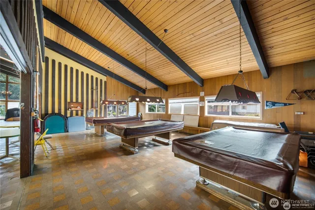 a view of a swimming pool with outdoor seating