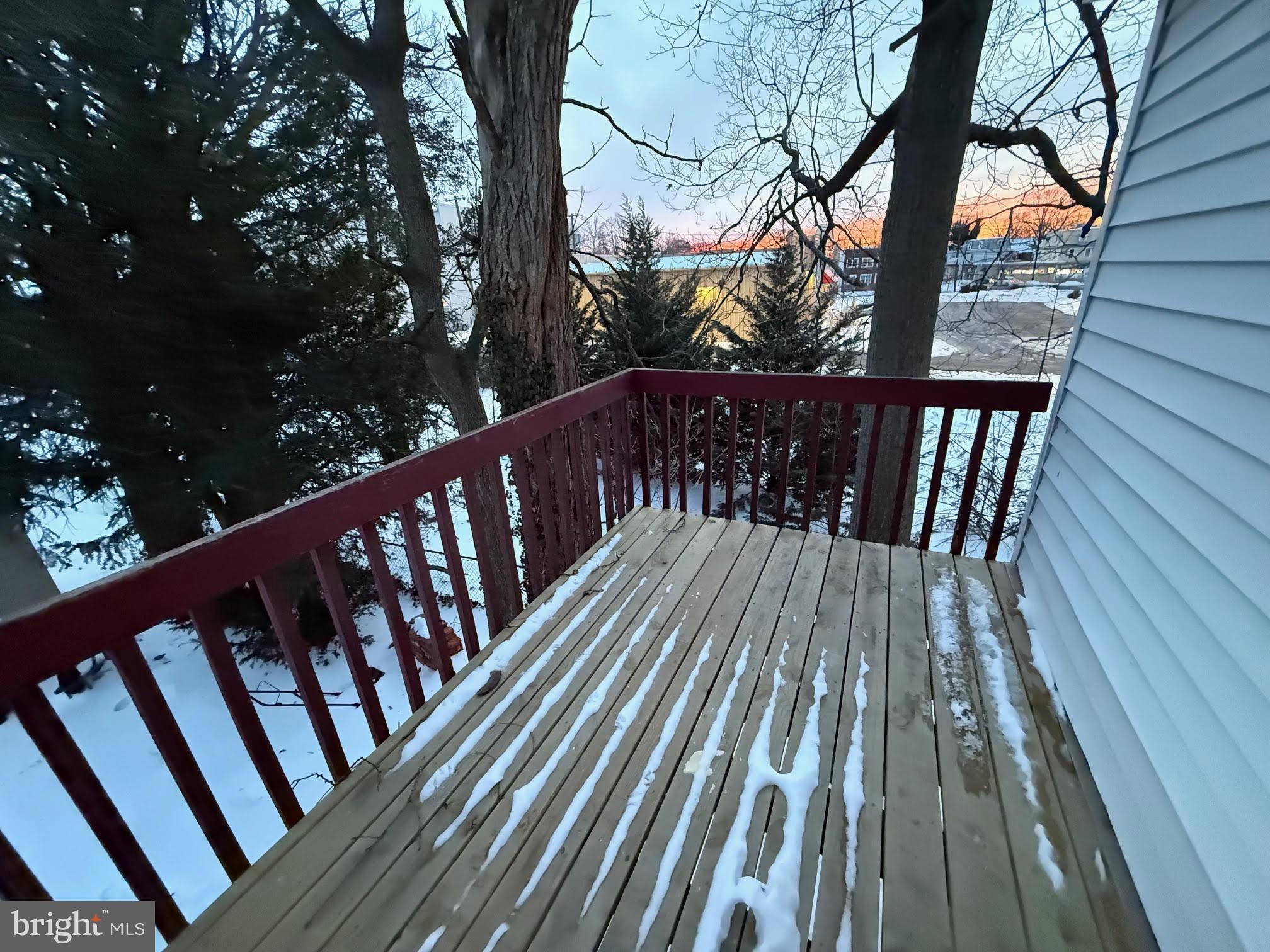 212 Warren Street Beverly, NJ 08010 - Photo 14 of 33 a view of balcony with wooden floor and fence