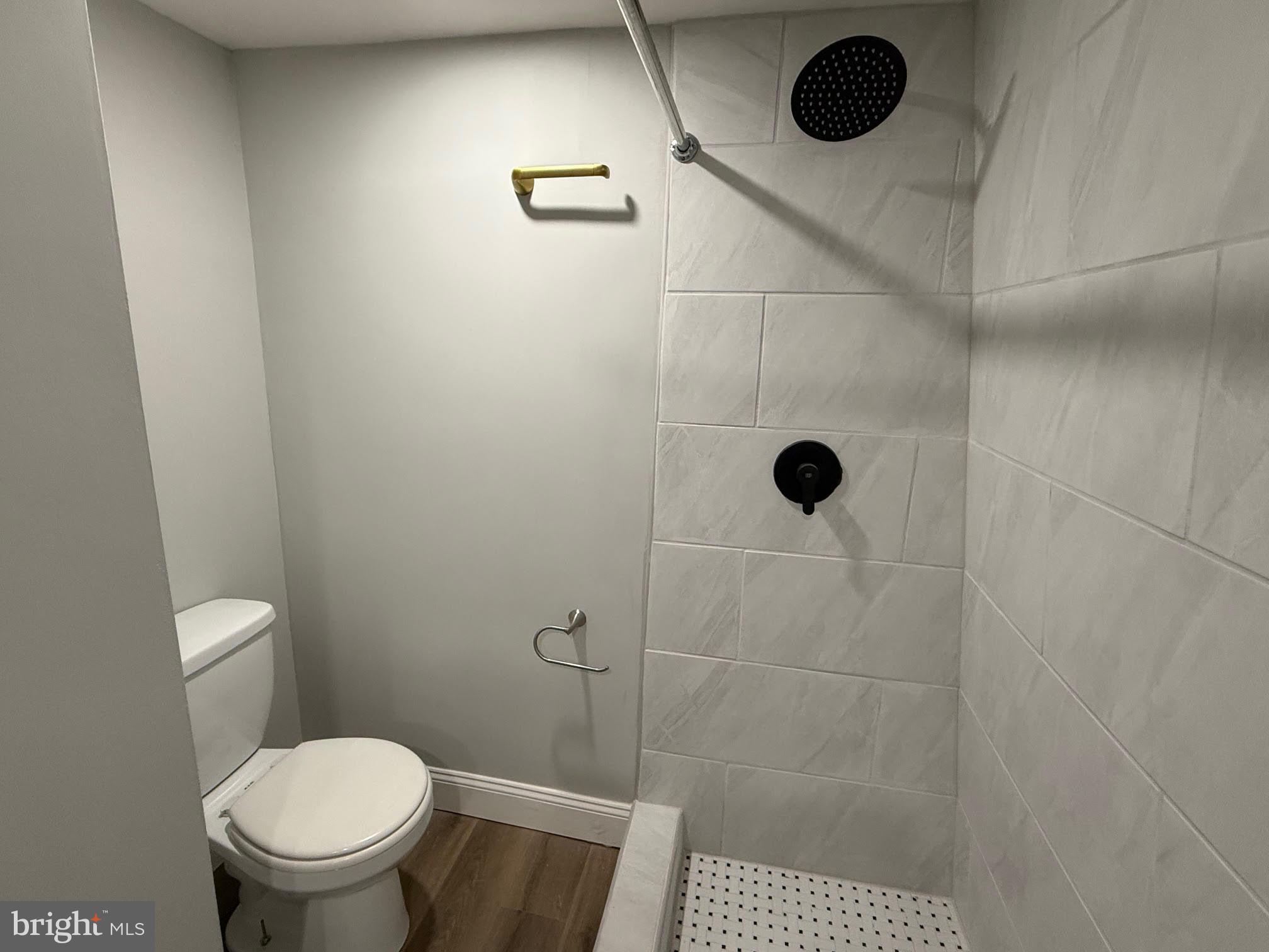212 Warren Street Beverly, NJ 08010 - Photo 20 of 33 a bathroom with a toilet and a shower