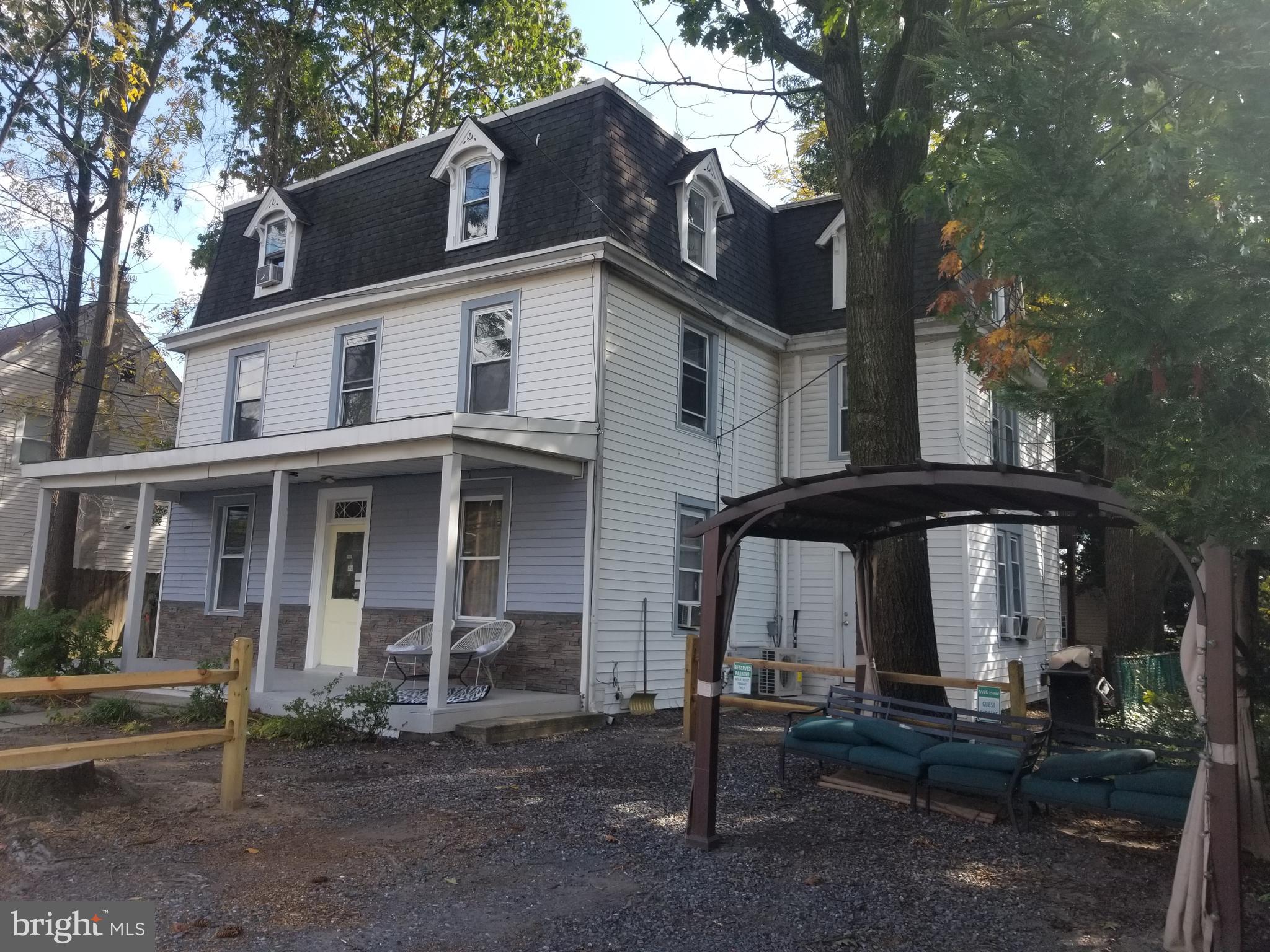 212 Warren Street Beverly, NJ 08010 - Photo 22 of 33 a front view of a house with parking