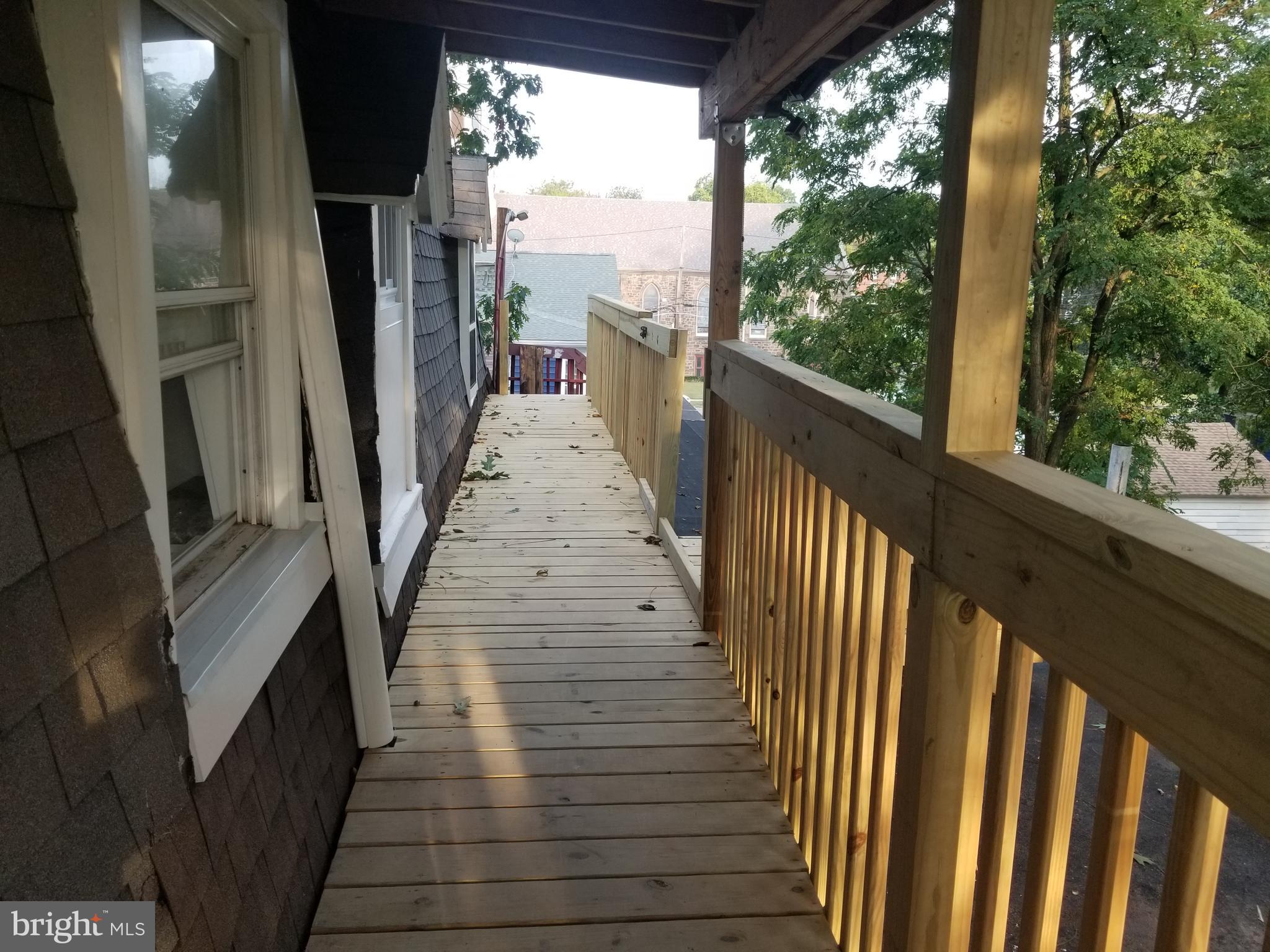 212 Warren Street Beverly, NJ 08010 - Photo 29 of 33 a view of a balcony with wooden floor
