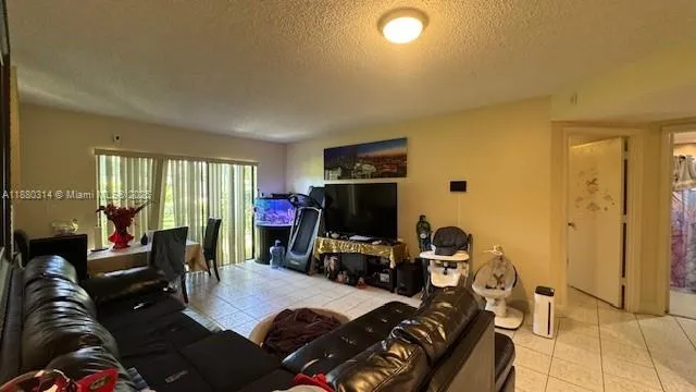 a bed room with a bed and a television