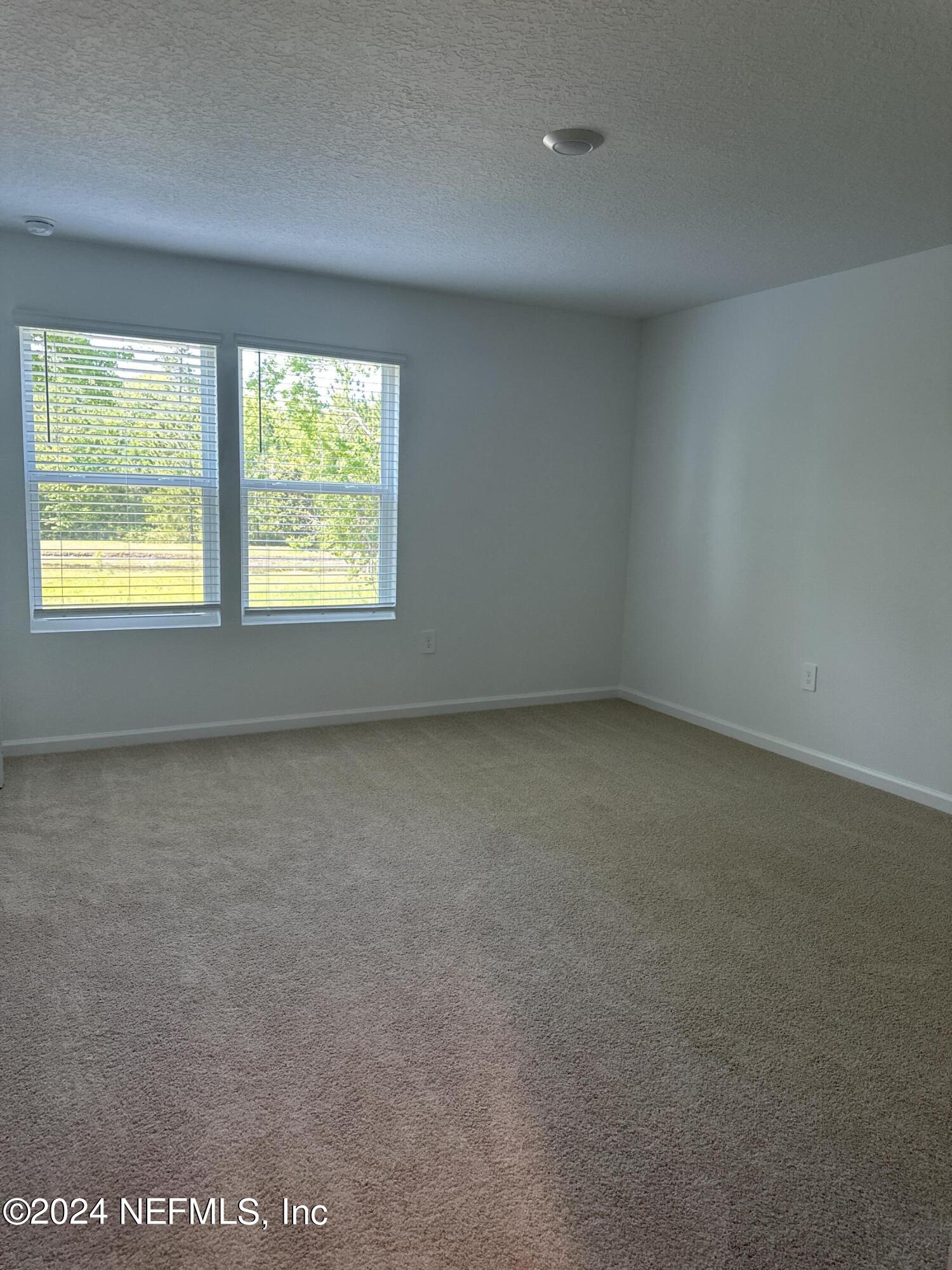 168 Tidal Bch Avenue St. Augustine, FL 32095 - Photo 12 of 36 an empty room with a window