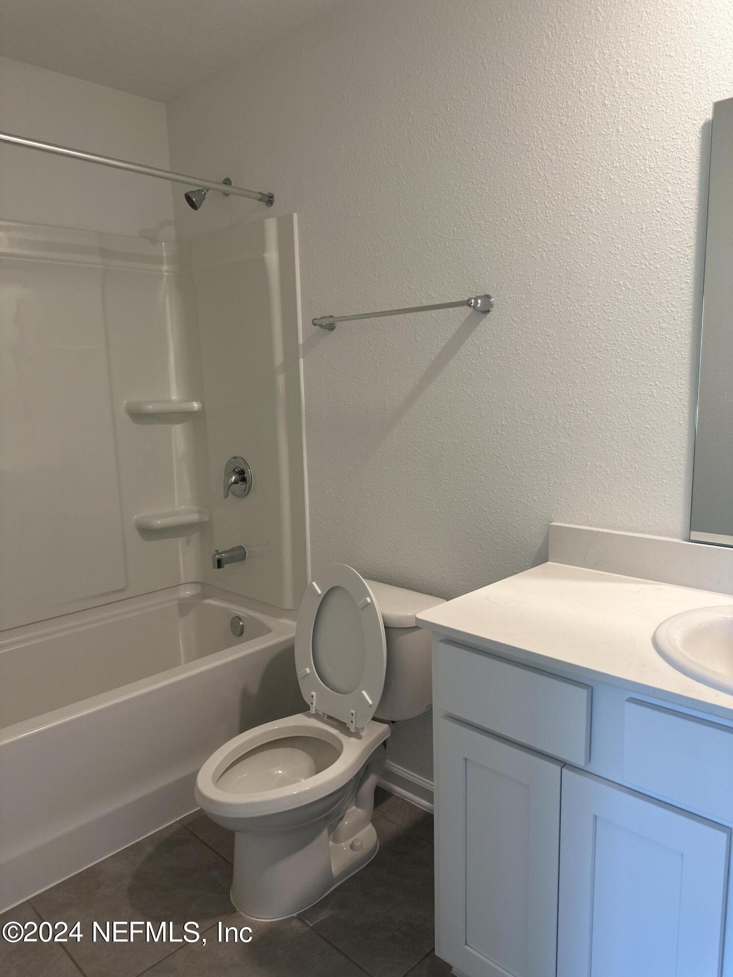 168 Tidal Bch Avenue St. Augustine, FL 32095 - Photo 16 of 36 a bathroom with a toilet a sink and a bathtub