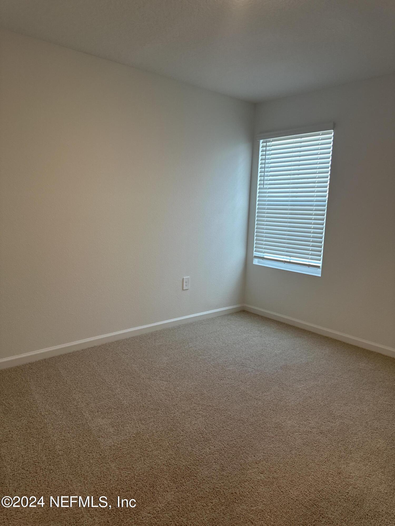 168 Tidal Bch Avenue St. Augustine, FL 32095 - Photo 17 of 36 an empty room with a window