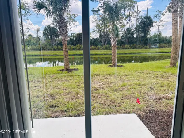 a view of a yard with a tree