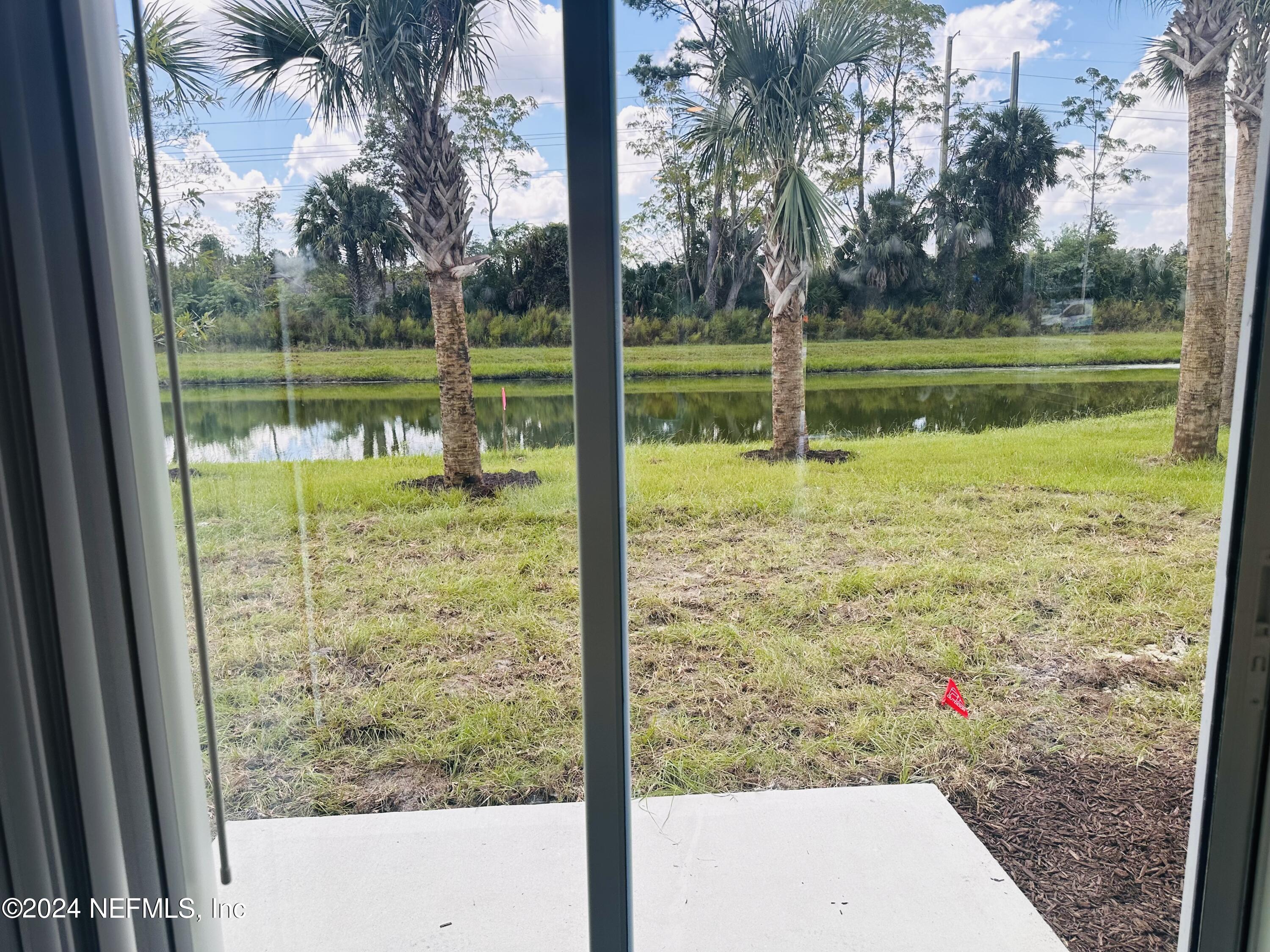 168 Tidal Bch Avenue St. Augustine, FL 32095 - Photo 35 of 36 a view of a yard with a tree