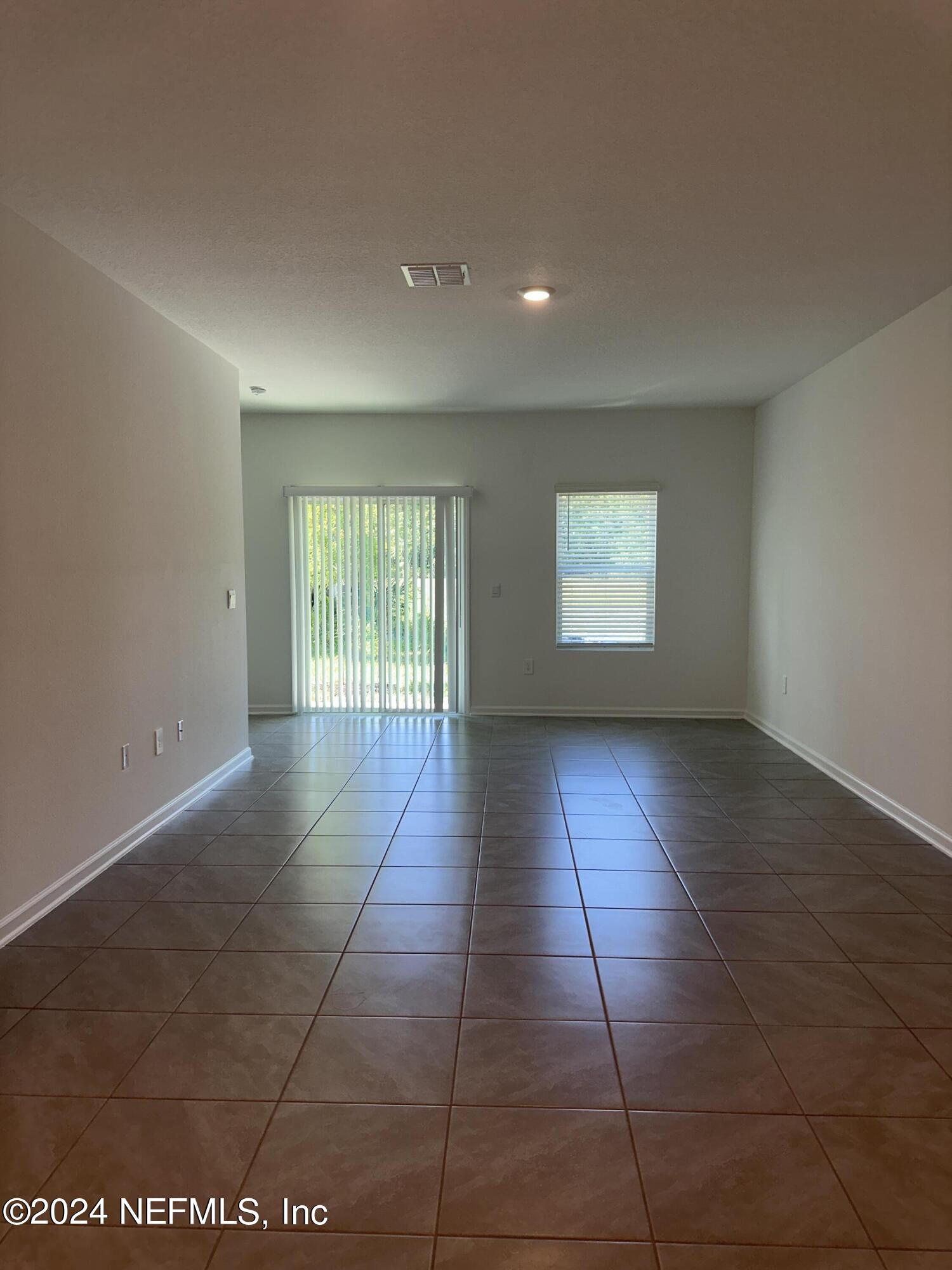 168 Tidal Bch Avenue St. Augustine, FL 32095 - Photo 7 of 36 a view of an empty room and window