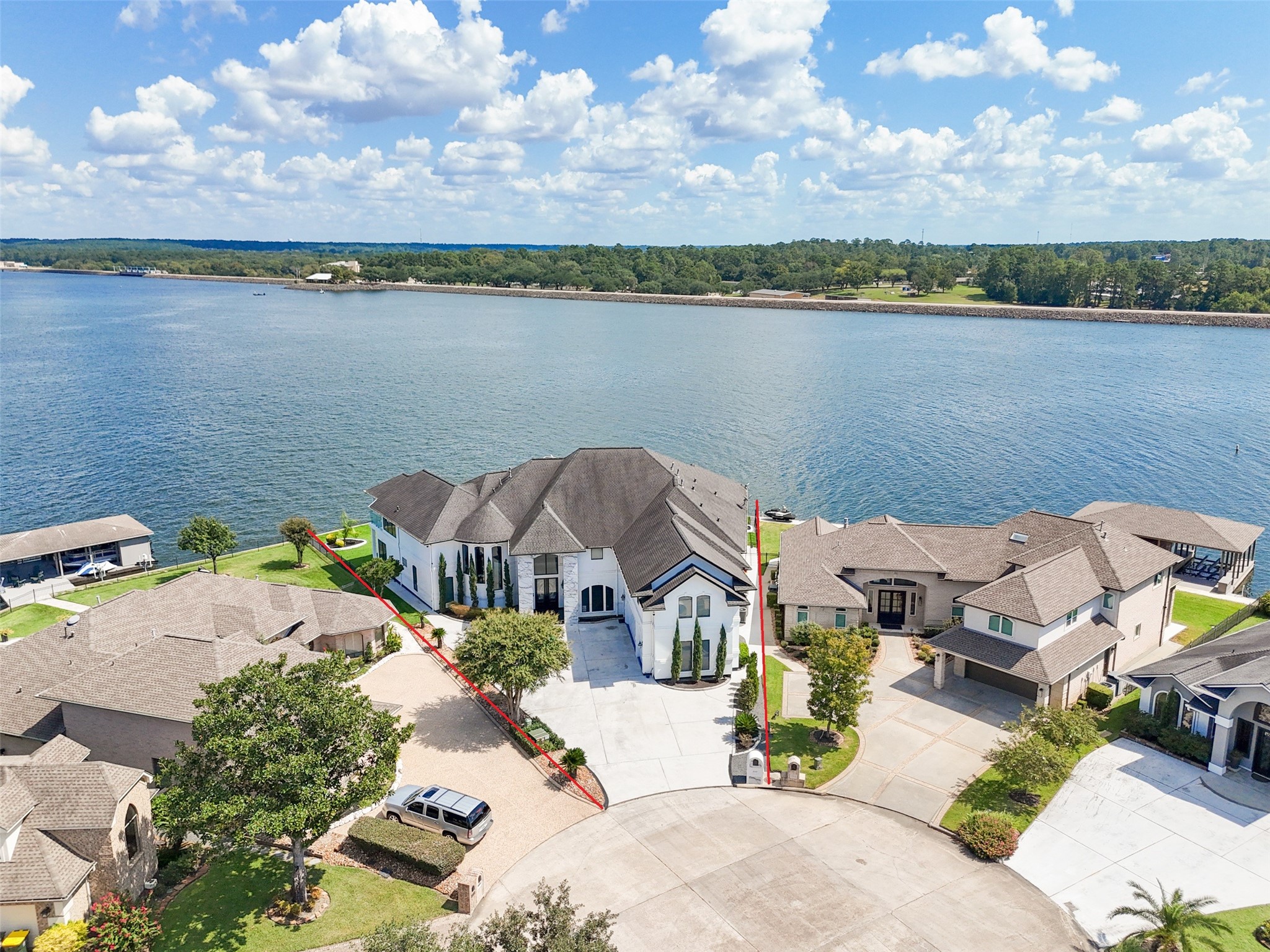 an aerial view of a house with a lake view